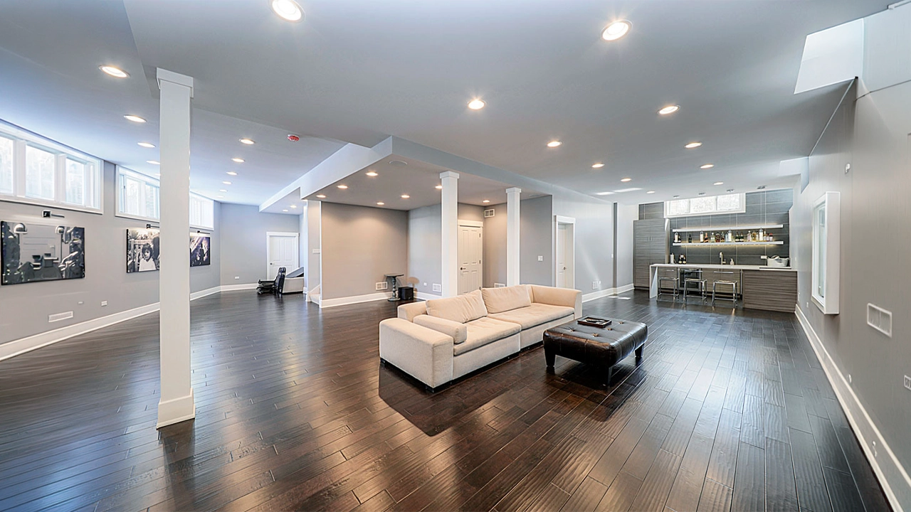Finished basement remodeling in Maryland with modern lighting and durable flooring
